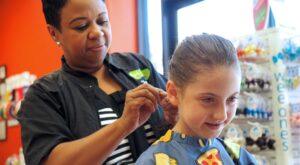 Girl getting her haircut and braided at Pigtails & Crewcuts Atlanta - Buckhead