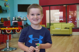 Smiling boy with a classic crew cut - Pigtails & Crewcuts Buckhead