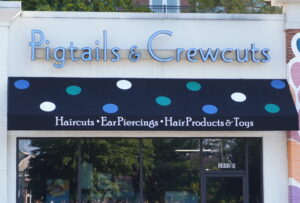 Exterior sign for Pigtails & Crewcuts Buckhead