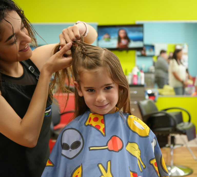 Girl getting her hair styled - Pigtails & Crewcuts Smyrna