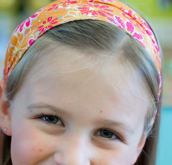 Girl wearing head band - Pigtails & Crewcuts Smyrna