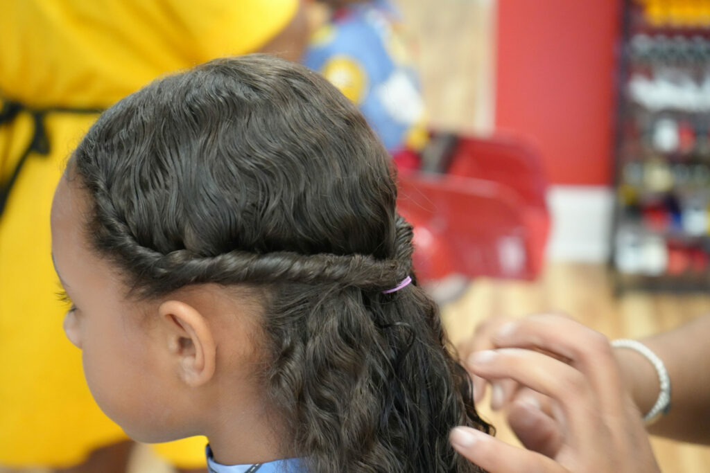 Girl getting her hair braided - Pigtails & Crewcuts Smyrna