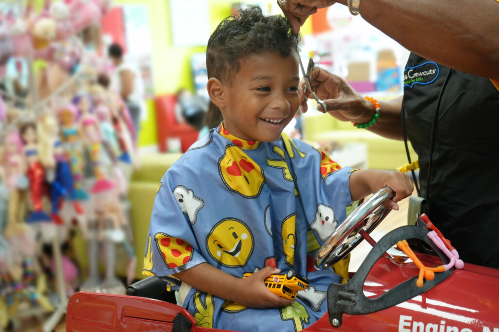 Smiling boy gets his hair cut - Pigtails & Crewcuts Smyrna/Vinings