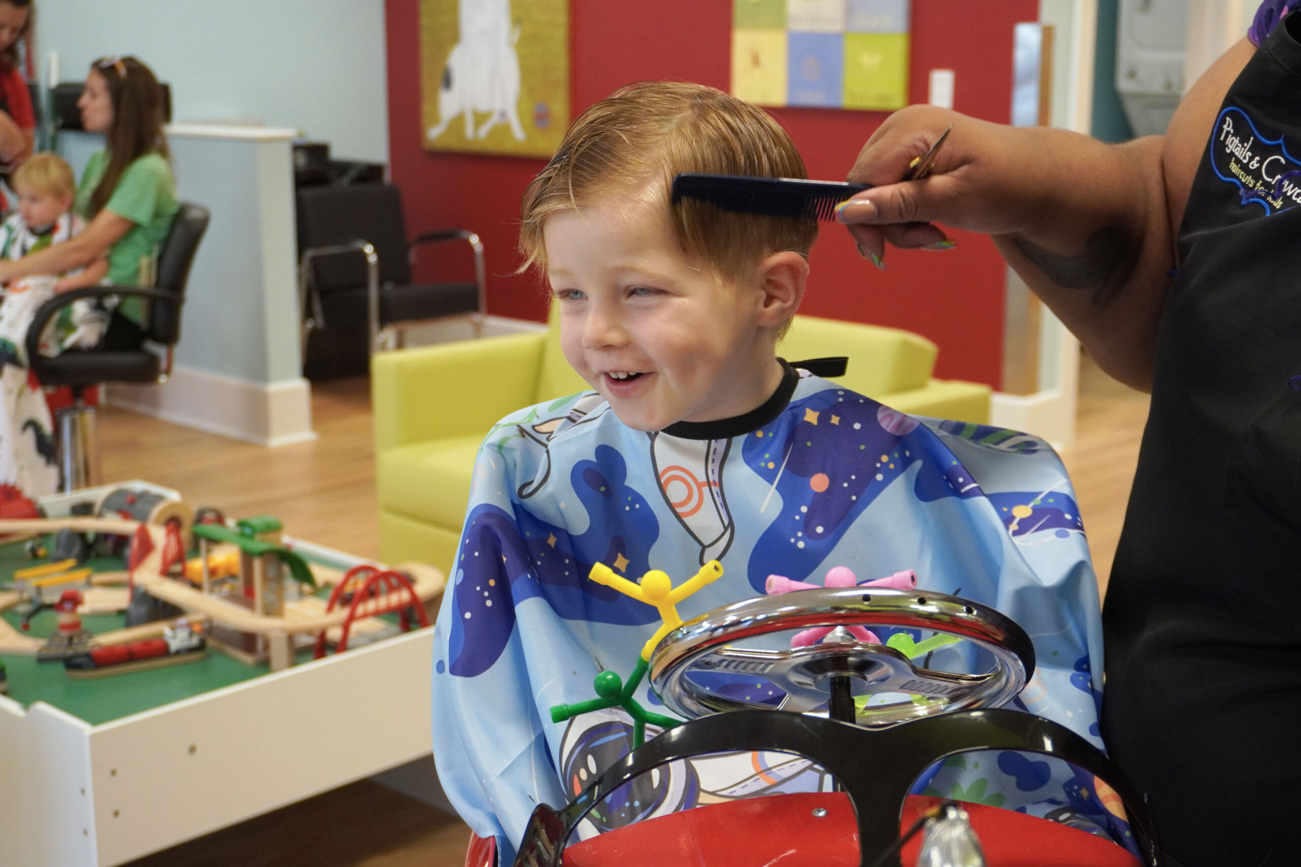 Smiling Boy gets his hair combed - Pigtails & Crewcuts Smyrna