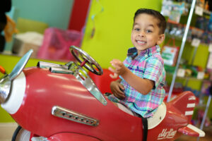 Little boy enjoying his time at Pigtails & Crewcuts Smyrna, which will be closing on December 18th, 2024.