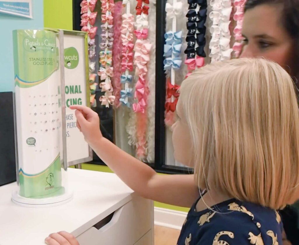 Picking out the earrings - Pigtails & Crewcuts Jacksonville