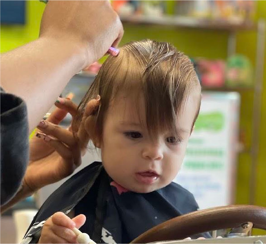 Baby girl getting a trim - Pigtails & Crewcuts Jacksonville