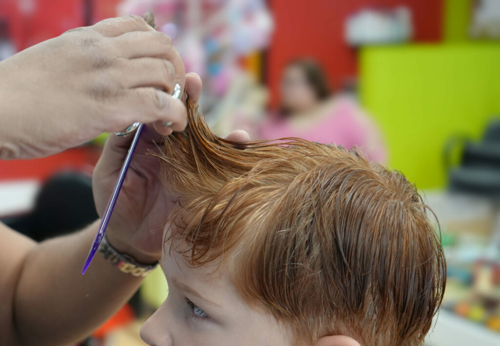 Boy getting his hair cut - Pigtails & Crewcuts Jacksonville