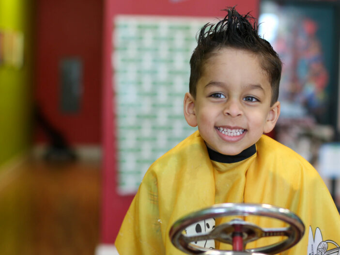 Smiling boy with spiky hair - Pigtails & Crewcuts Jacksonville