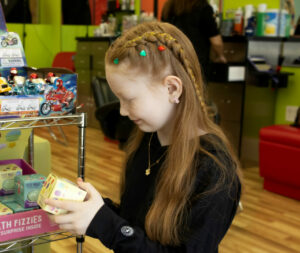 Smiling girl with fun braid - Pigtails & Crewcuts Jacksonville