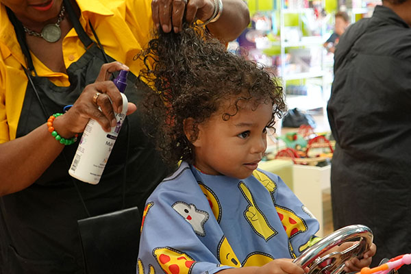 Kid Getting Product in Their Hair During Haircut - Pigtails & Crewcuts Mount Pleasant